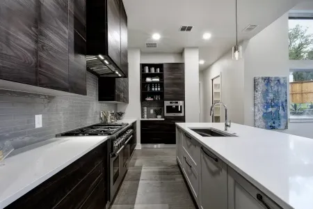 White counters and black custom cabinets