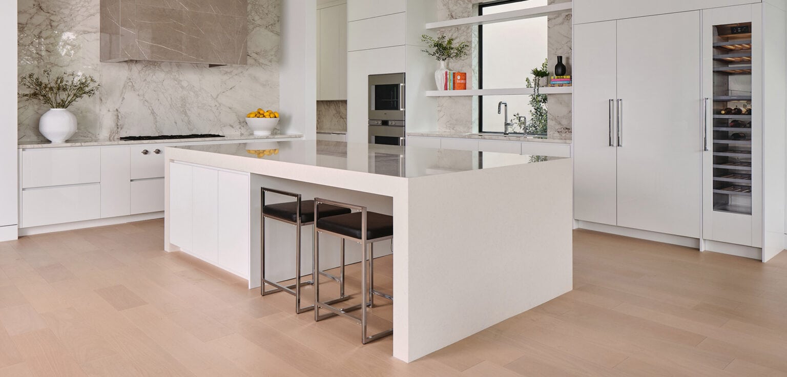 Modern organic luxury kitchen with creamy quartzite island and custom cabinetry in The Dominion, San Antonio