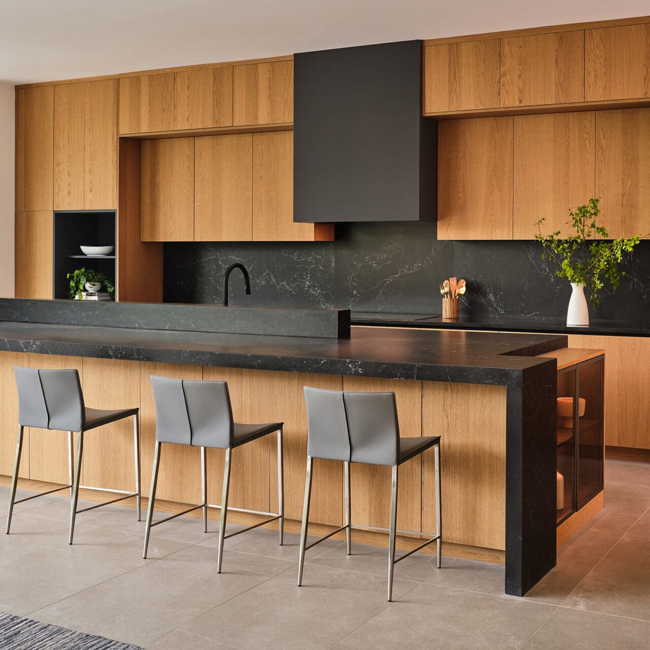 Bespoke kitchen cabinetry with large island and bar seating in The Dominion, San Antonio