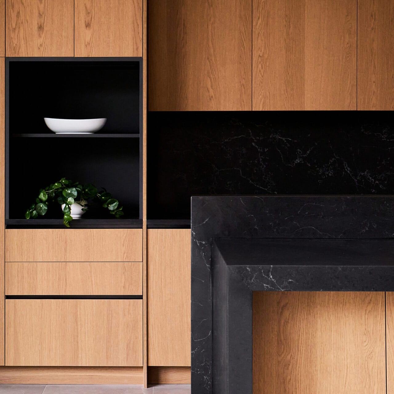 Custom kitchen cabinetry detail with open shelving and stone surfaces in The Dominion, San Antonio
